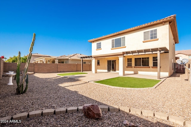 rear view of property with a patio area