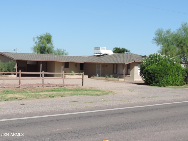 ranch-style home featuring central AC