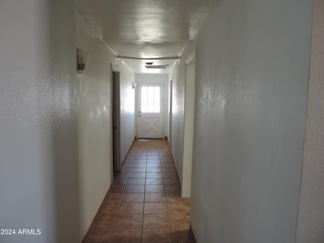 corridor with tile patterned flooring