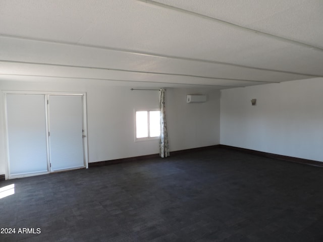 empty room featuring a wall mounted air conditioner