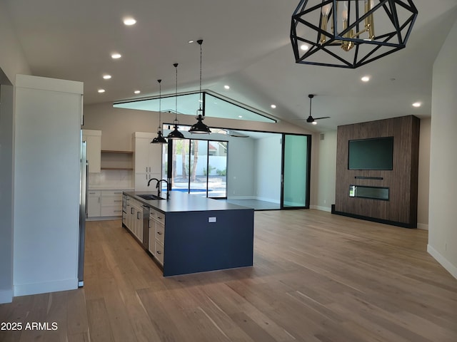 7724 E Charter Oak Rd, Scottsdale, AZ 85260 - kitchen featuring white cabinetry, open shelves, an island with sink, light wood-type flooring, and recessed lighting