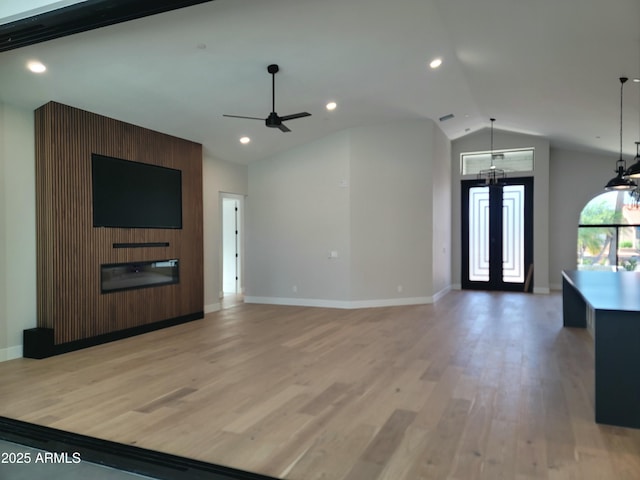 7724 E Charter Oak Rd, Scottsdale, AZ 85260 - unfurnished living room featuring vaulted ceiling, ceiling fan, light wood finished floors, and recessed lighting