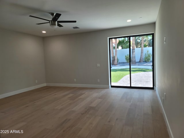 7724 E Charter Oak Rd, Scottsdale, AZ 85260 - spare room with light wood-style floors, ceiling fan, and recessed lighting
