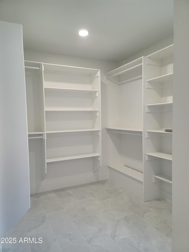 7724 E Charter Oak Rd, Scottsdale, AZ 85260 - walk in closet with marble finish flooring