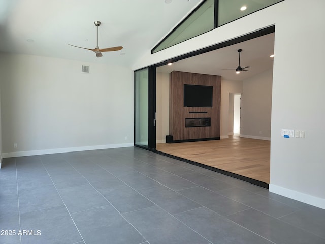 7724 E Charter Oak Rd, Scottsdale, AZ 85260 - tiled empty room with ceiling fan, lofted ceiling, and recessed lighting