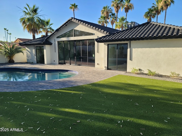 7724 E Charter Oak Rd, Scottsdale, AZ 85260 - rear view of house with a patio, stucco siding, a yard, an outdoor pool, and a tile roof