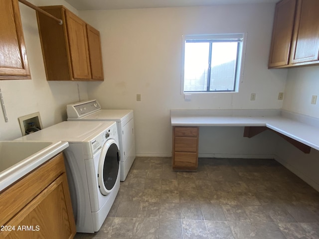 laundry area featuring cabinets and washer and dryer