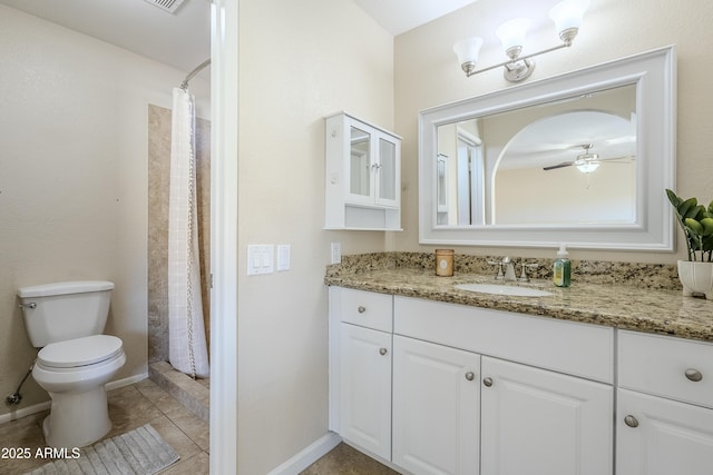 bathroom with tile patterned floors, toilet, vanity, a shower with shower curtain, and ceiling fan