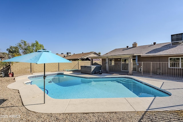 view of pool featuring central AC, a hot tub, and a patio