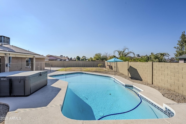 view of swimming pool with a hot tub and central AC