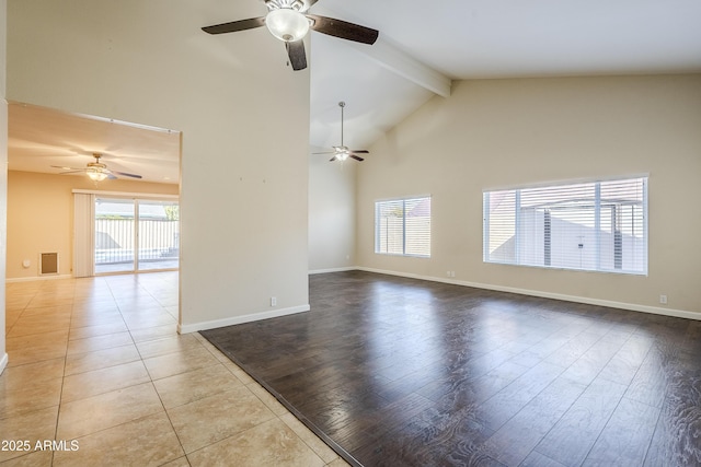 spare room featuring ceiling fan, high vaulted ceiling, light hardwood / wood-style floors, and beamed ceiling