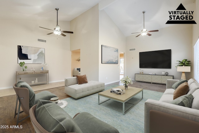 living room featuring beam ceiling, high vaulted ceiling, ceiling fan, and light hardwood / wood-style flooring