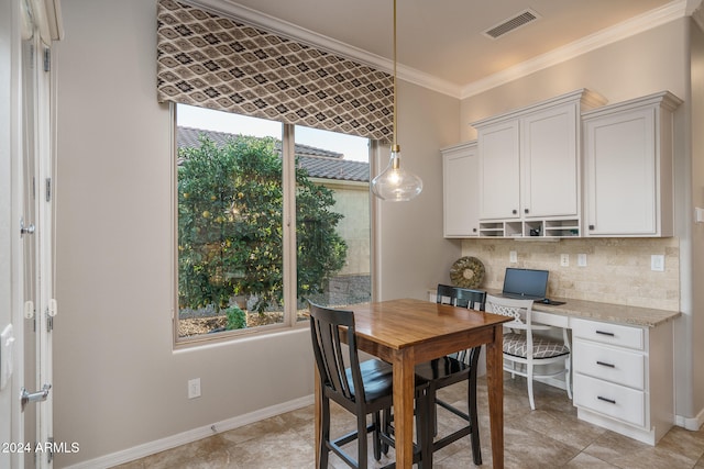 dining room with crown molding