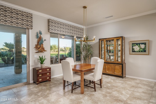 dining room featuring crown molding