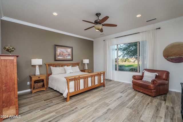 bedroom featuring ceiling fan, ornamental molding, and light wood-type flooring