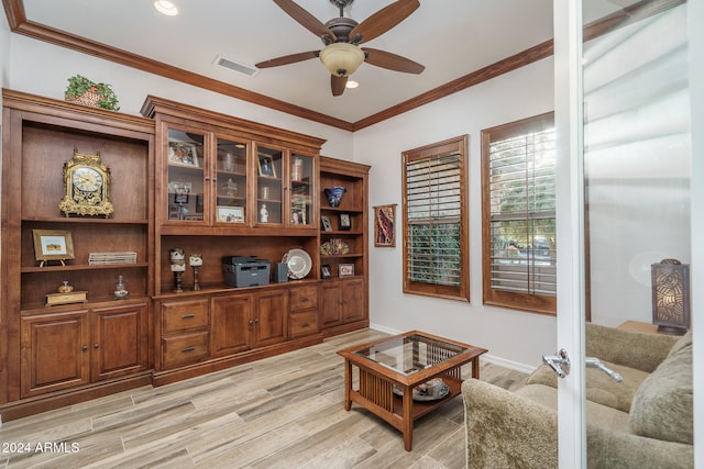 living room featuring light hardwood / wood-style floors, ceiling fan, and ornamental molding