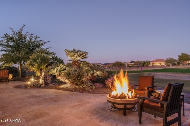 patio terrace at dusk with an outdoor fire pit