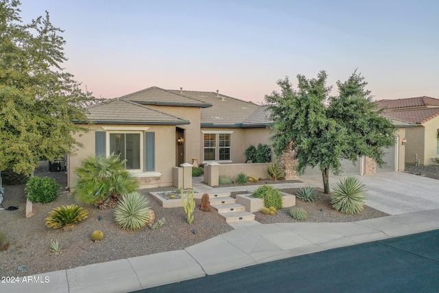 view of front of property with a garage