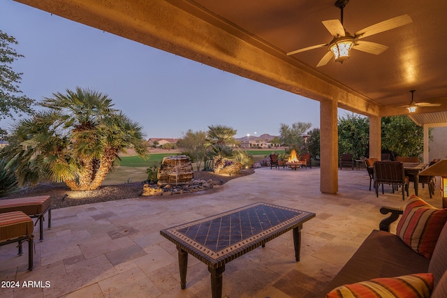 patio terrace at dusk with ceiling fan