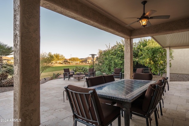 view of patio featuring ceiling fan