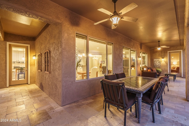 view of patio featuring ceiling fan