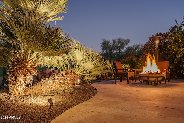 patio terrace at dusk with a fire pit