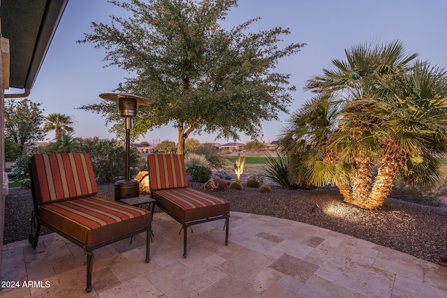 view of patio terrace at dusk