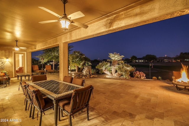 patio at night with ceiling fan