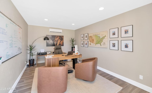 5971 E Orange Blossom Ln, Phoenix, AZ 85018 - home office featuring wood finished floors, recessed lighting, and an AC wall unit