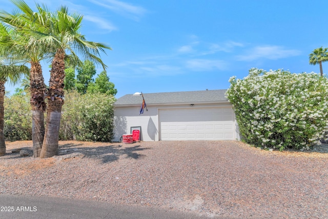 5971 E Orange Blossom Ln, Phoenix, AZ 85018 - view of front of home featuring gravel driveway and a garage