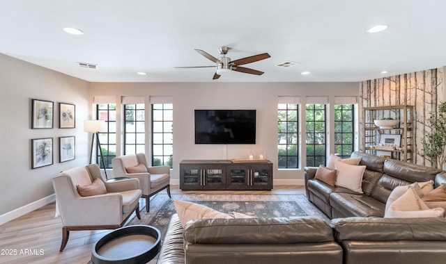 5971 E Orange Blossom Ln, Phoenix, AZ 85018 - living area featuring light wood-style flooring, recessed lighting, and a ceiling fan