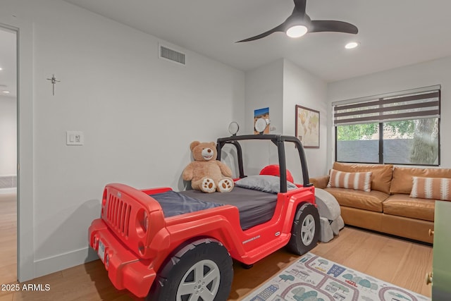 bedroom featuring wood-type flooring and ceiling fan