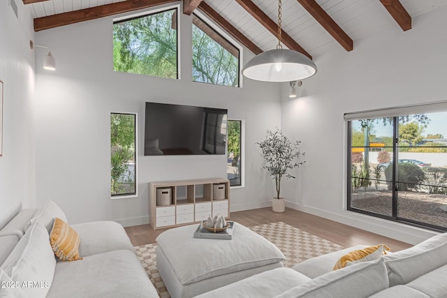 living room featuring beamed ceiling, wood ceiling, high vaulted ceiling, and light hardwood / wood-style floors