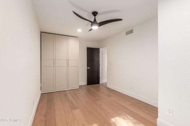 8005 N Via De Lago, Scottsdale, AZ 85258 - unfurnished bedroom featuring light wood-style floors, baseboards, recessed lighting, and a ceiling fan