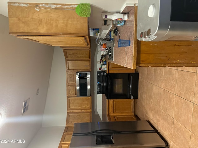 kitchen featuring extractor fan and oven