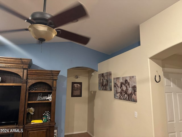 interior space with ceiling fan