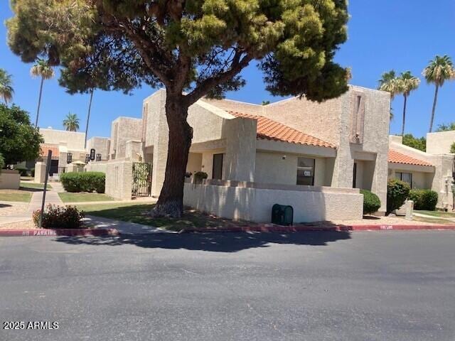 774 E Morningside Dr, Phoenix, AZ 85022 - view of front facade with a tile roof and stucco siding