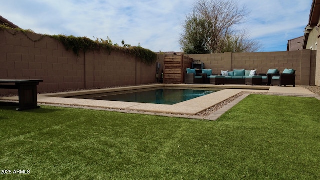 view of pool with outdoor lounge area and a lawn