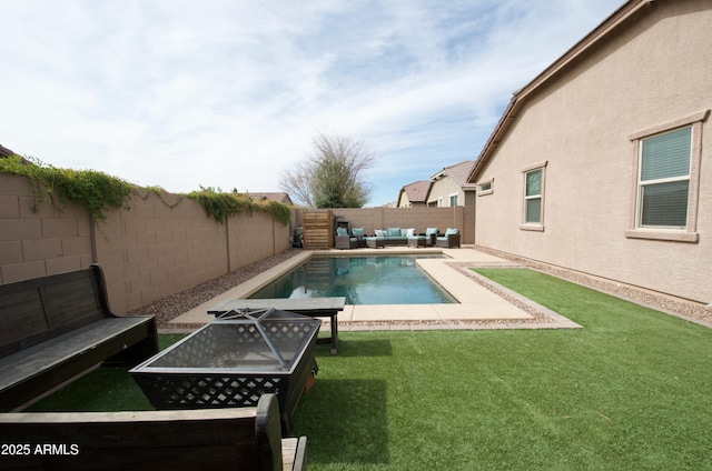 view of pool with an outdoor hangout area and a lawn