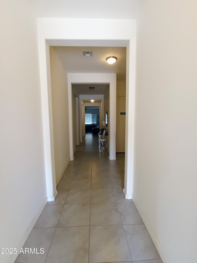 hallway with light tile patterned floors