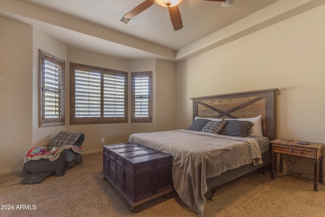 bedroom featuring ceiling fan and light carpet