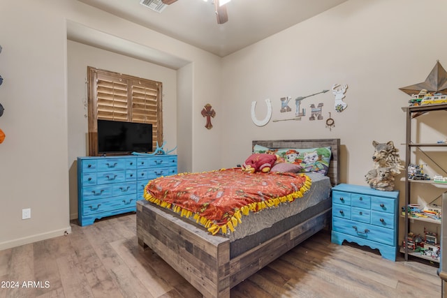 bedroom with ceiling fan and wood-type flooring