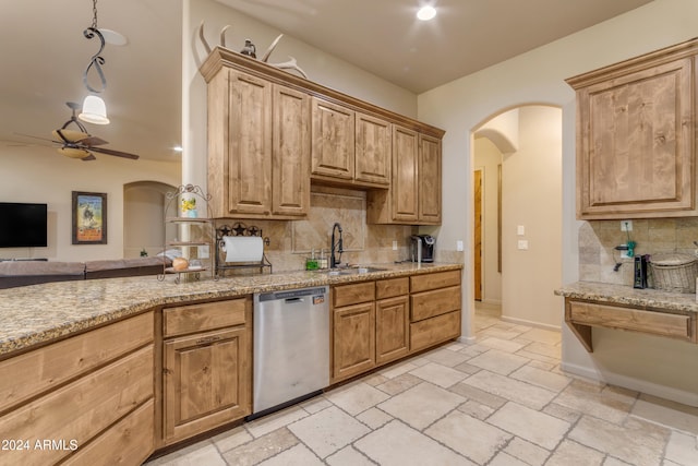 kitchen with sink, dishwasher, ceiling fan, and decorative backsplash