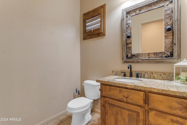 bathroom with tile patterned floors, toilet, and vanity