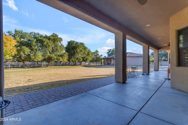 view of patio featuring ceiling fan