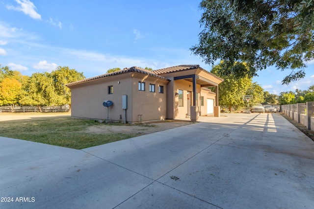 rear view of property with a lawn