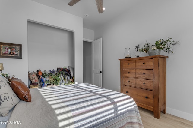 bedroom with light hardwood / wood-style flooring and ceiling fan