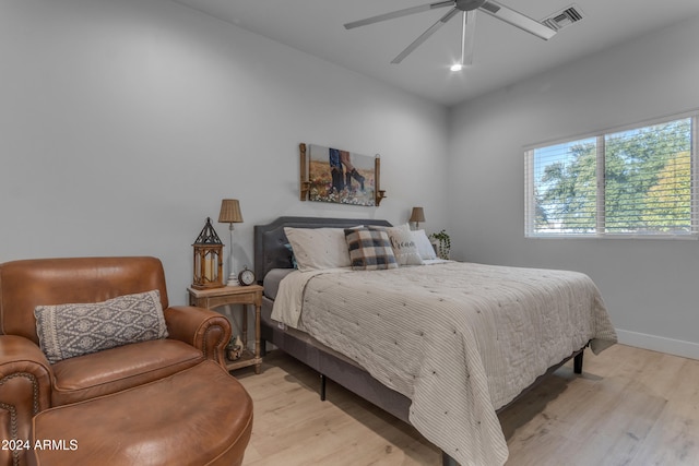 bedroom featuring light hardwood / wood-style flooring and ceiling fan