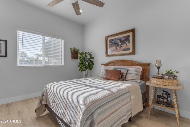 bedroom featuring ceiling fan and light hardwood / wood-style flooring