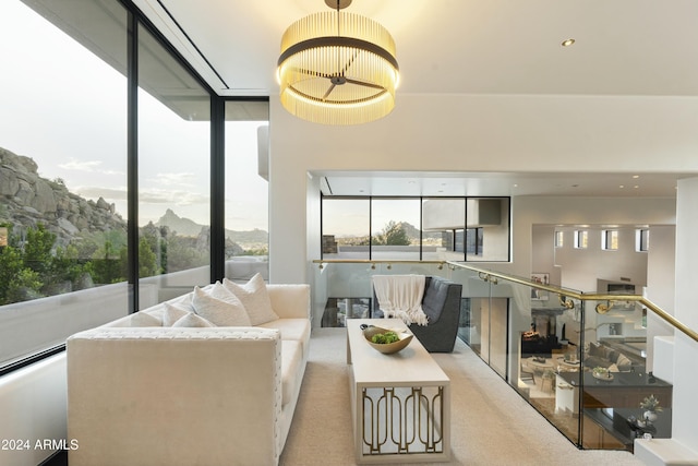 living room with a mountain view and a healthy amount of sunlight